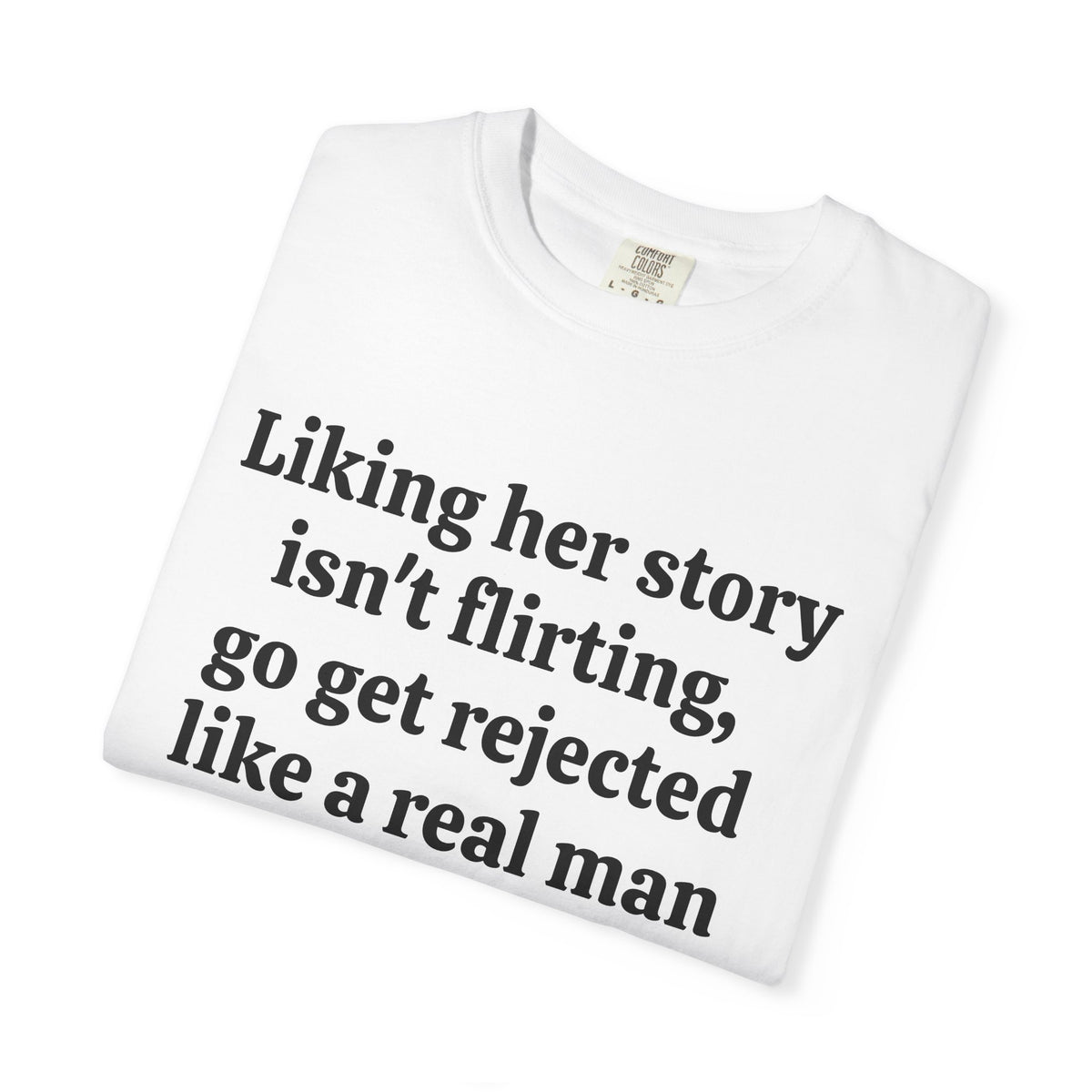 White Rejected Like A Real Man tee folded, close-up of print