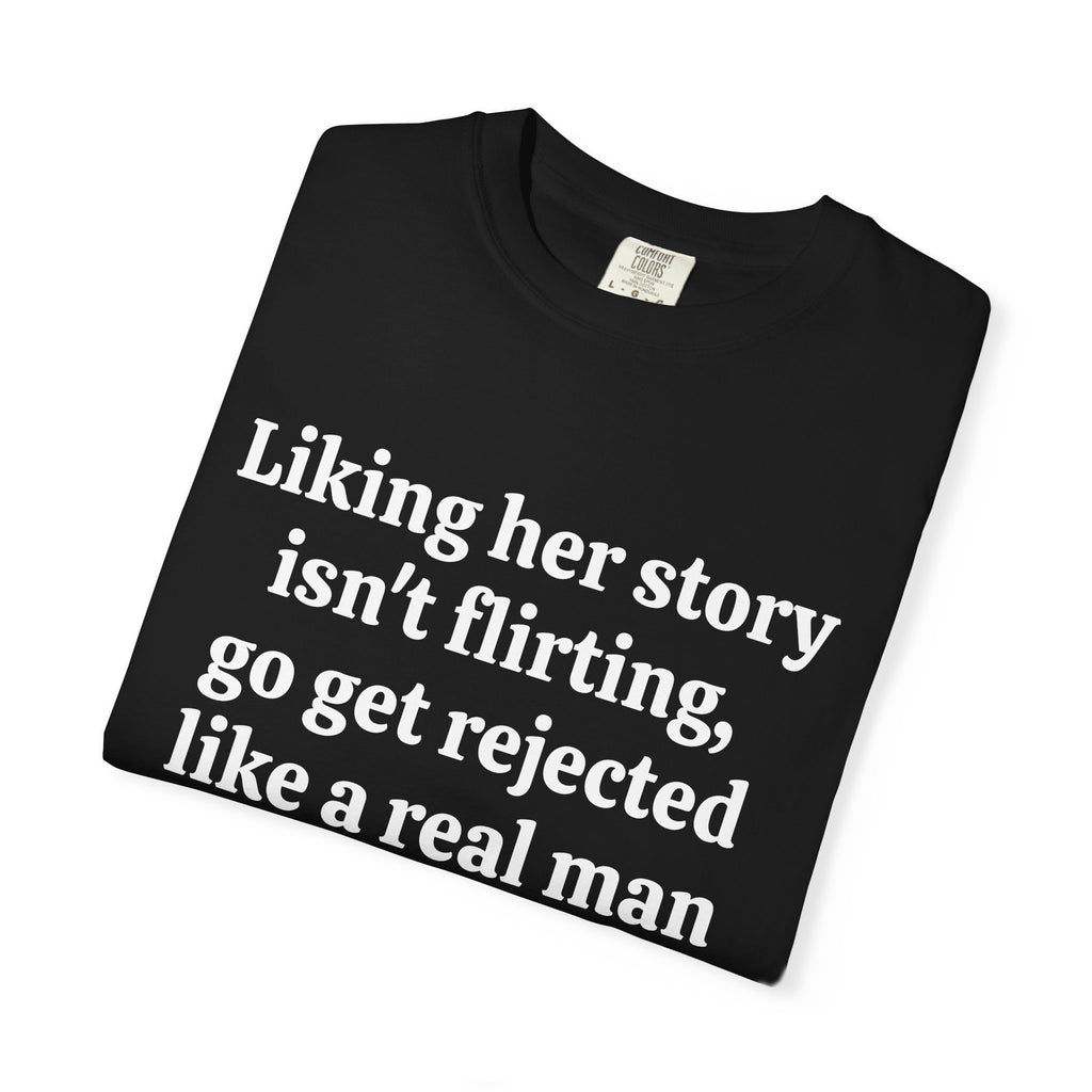 Black Rejected Like A Real Man tee folded, close-up of white print
