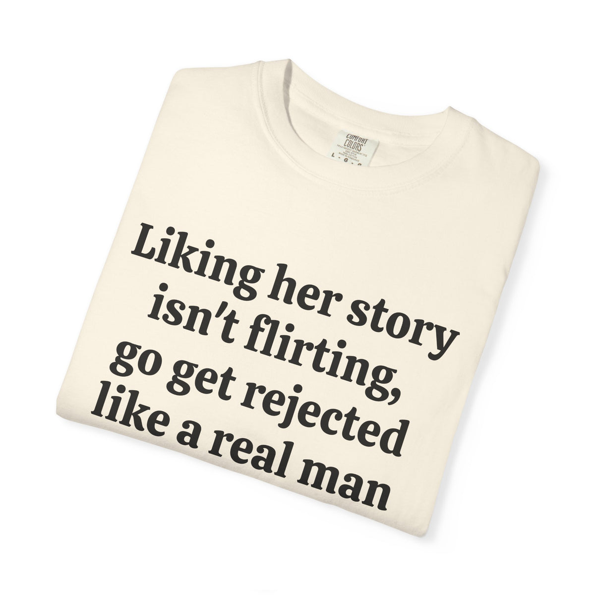 Ivory Rejected Like A Real Man tee folded, close-up of print