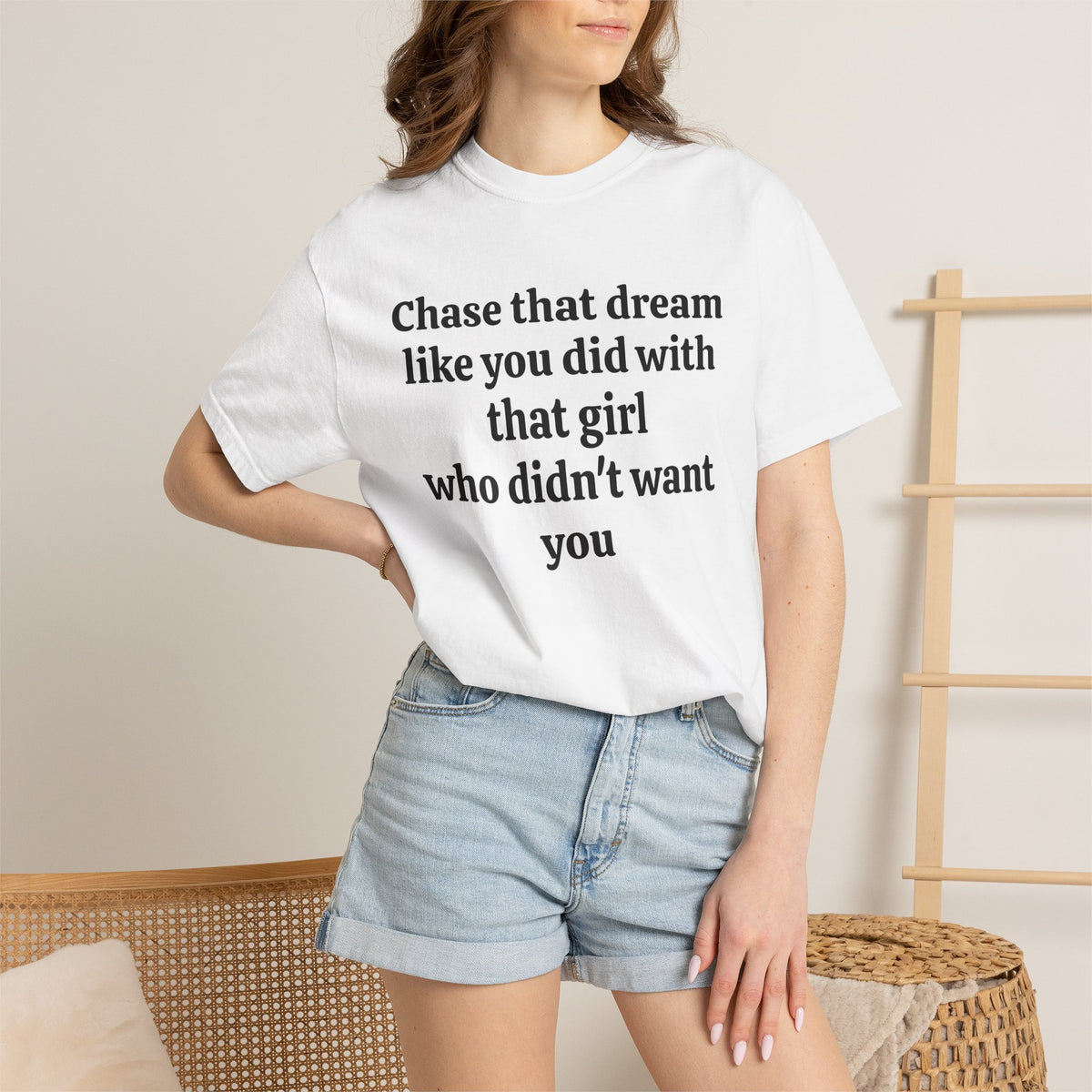 Model wearing White Chase That Dream tee with denim shorts